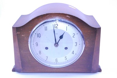 Lot 6 - A 1950s walnut cased mantel clock having...