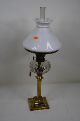 Lot 105 - An early 20th century oil lamp with chimney,...