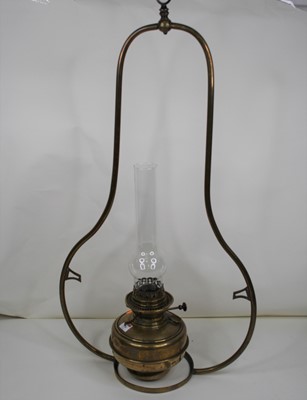 Lot 110 - An early 20th century brass hanging oil lamp,...