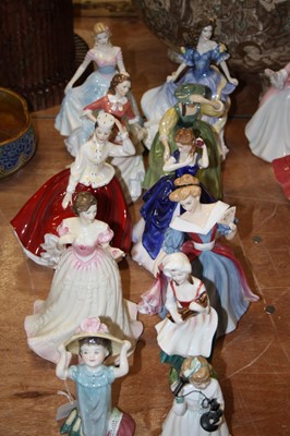 Lot 119 - A collection of 11 Royal Doulton figurines to...