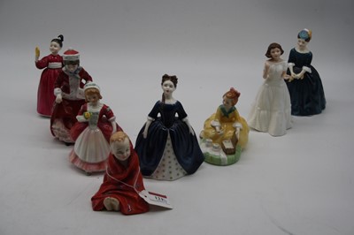 Lot 121 - A collection of eight Royal Doulton figurines...