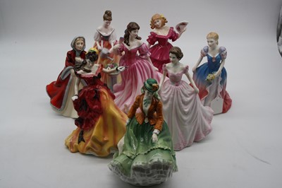 Lot 122 - A collection of eight Royal Doulton figurines...