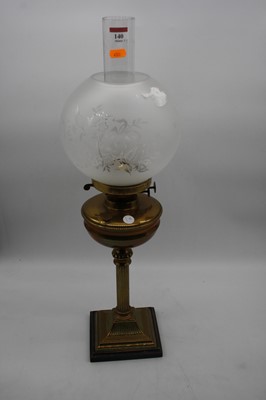 Lot 140 - An early 20th century oil lamp, having...