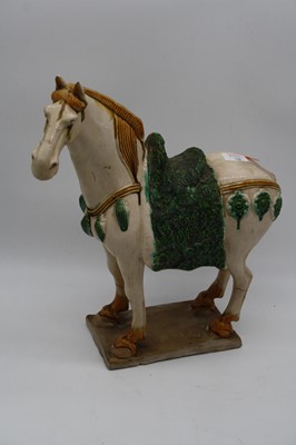 Lot 142 - A Tang style hollow moulded model of a horse...