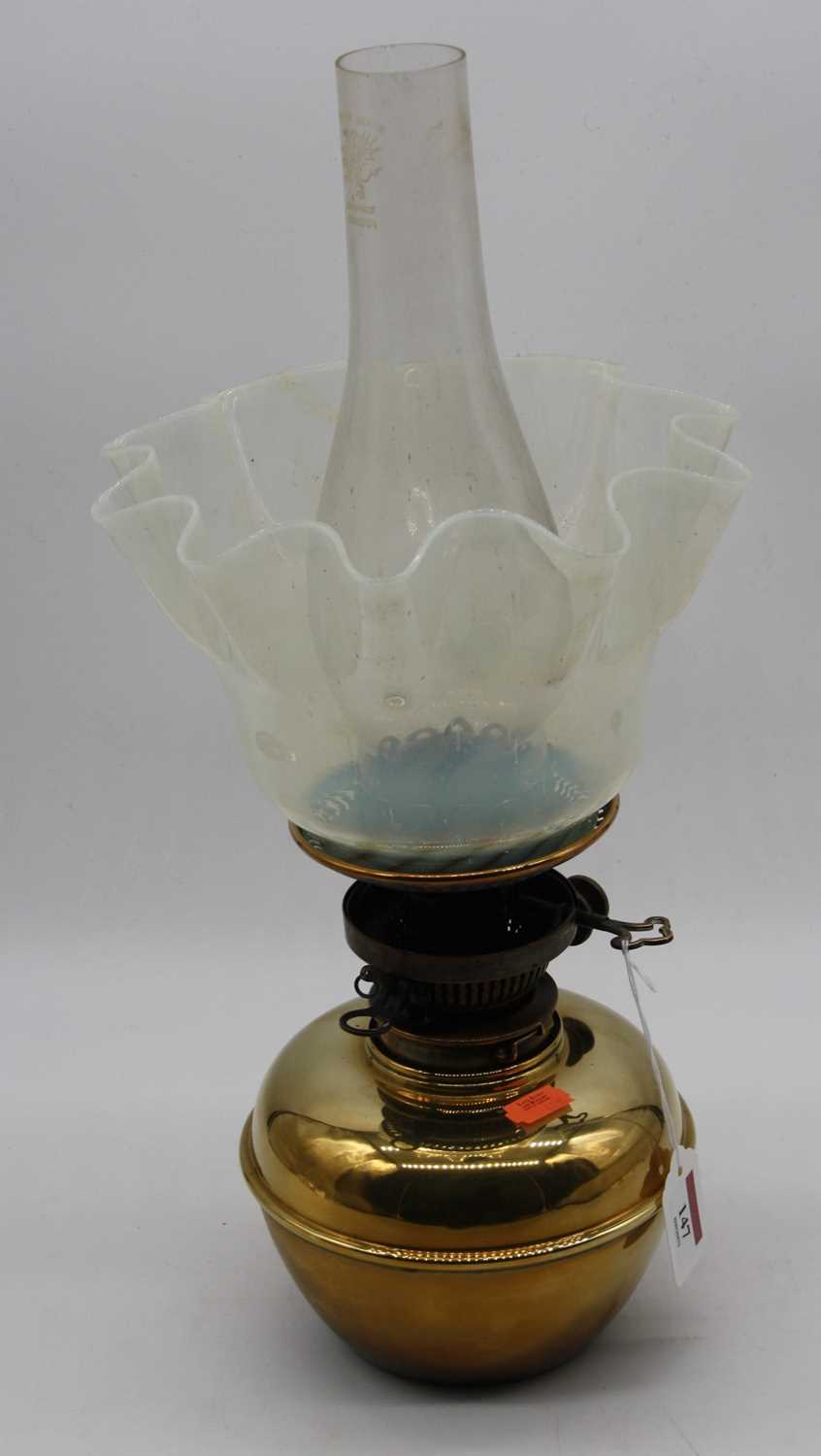 Lot 147 - A late Victorian brass oil lamp with chimney,...