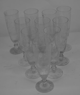 Lot 154 - A set of ten Edwardian glass flutes, each...