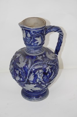 Lot 156 - A German Westerwald pottery jug, relief...