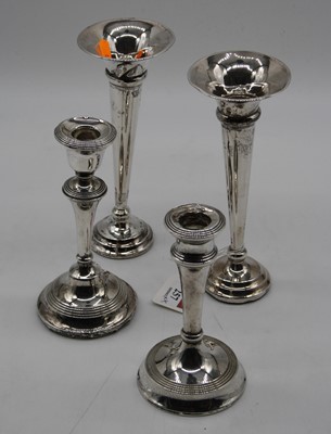 Lot 257 - A pair of George V silver spill vases, each of...
