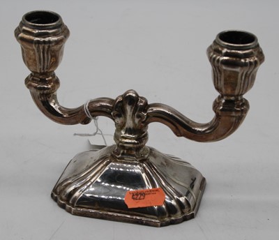 Lot 285 - A continental twin branch table candlestick,...