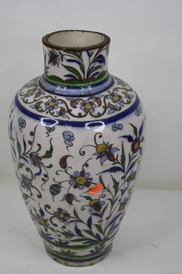 Lot 97 - An Iznik tin glazed earthenware vase (ground...