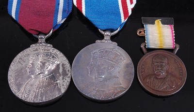 Lot 35 - A collection of four medals, to include George...