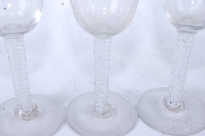 Lot 1045 - A set of five 18th century style wine glasses,...
