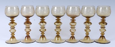 Lot 1051 - A set of seven 20th century German amber glass...