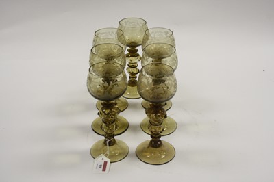 Lot 1051 - A set of seven 20th century German amber glass...