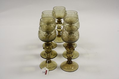 Lot 99 - A set of seven 20th century German amber glass...