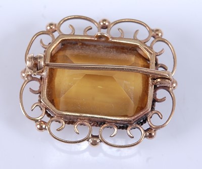 Lot 2549 - A yellow metal citrine brooch, featuring a...