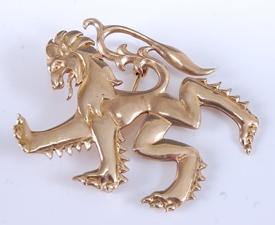 Lot 2552 - A 9ct yellow gold lion rampant brooch, with...