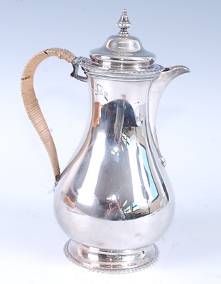 Lot 1115 - A George VI silver hot water pot, of plain...
