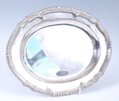 Lot 1113 - A mid-20th century silver salver, of shaped...