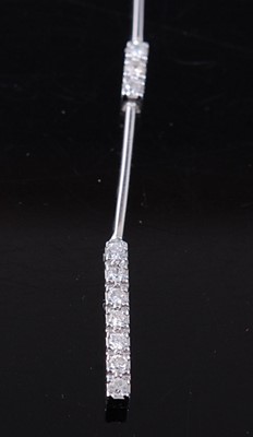 Lot 2574 - An 18ct white gold diamond pendant and earring...