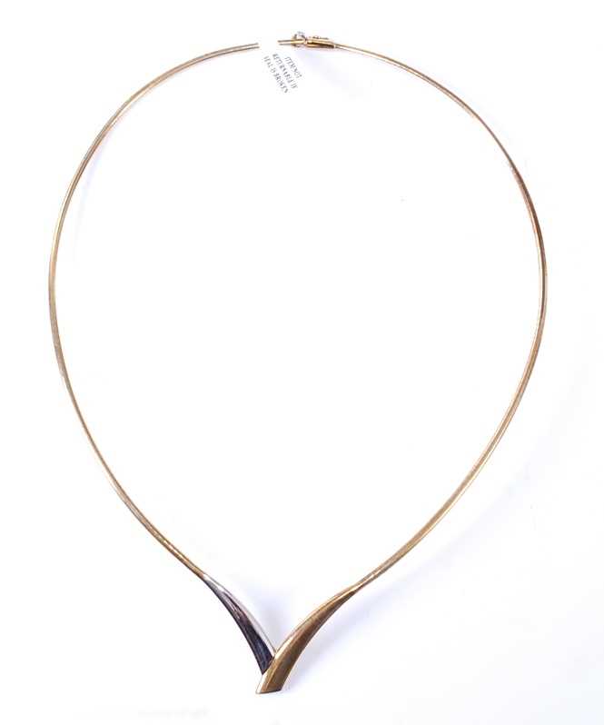 Lot 2577 - A 9ct yellow and white gold wishbone necklet,...
