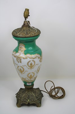 Lot 2 - A 20th century green and gilt decorated milk...