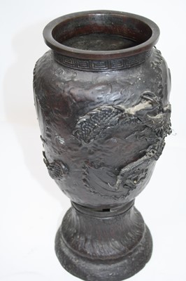 Lot 7 - A Japanese bronze vase, relief decorated with...