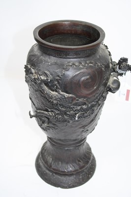 Lot 7 - A Japanese bronze vase, relief decorated with...