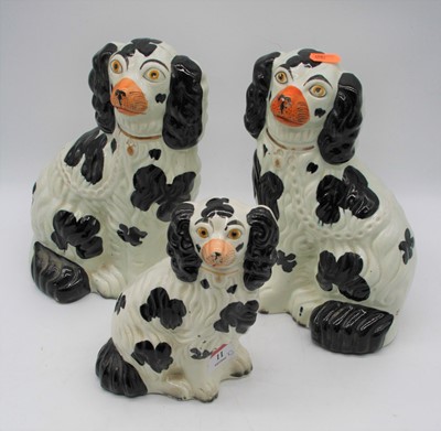 Lot 11 - A set of three Staffordshire pottery model of...