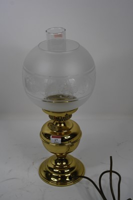 Lot 17 - A late Victorian brass oil lamp (converted)...