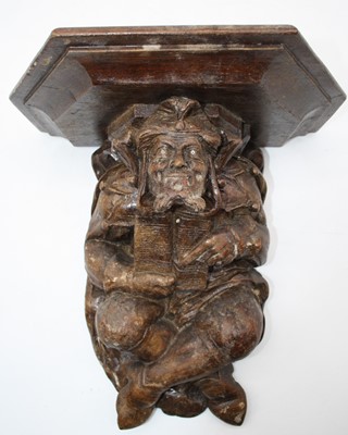 Lot 25 - A 20th century figural carved wall bracket in...