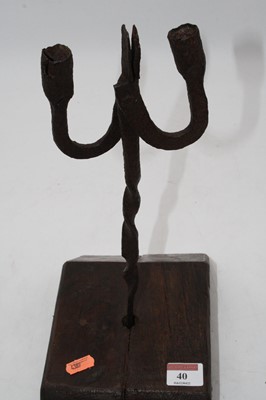 Lot 40 - An antique wrought iron rushlight holder,...