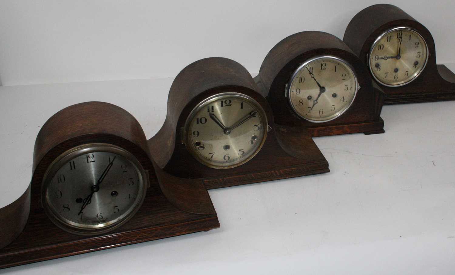 Lot 105 - A 1930s oak cased mantel clock, having a...