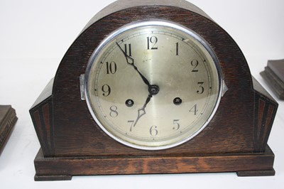 Lot 105 - A 1930s oak cased mantel clock, having a...