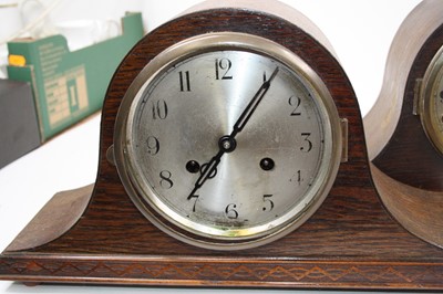 Lot 105 - A 1930s oak cased mantel clock, having a...