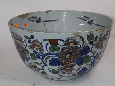 Lot 114 - A large 19th century tin glazed punch bowl,...