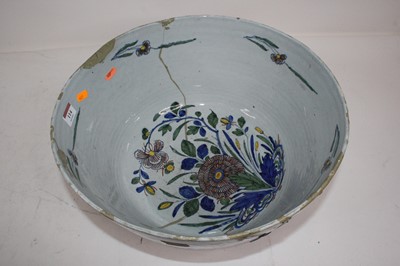 Lot 114 - A large 19th century tin glazed punch bowl,...