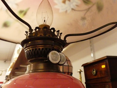 Lot 120 - A Victorian brass pedestal oil lamp having...