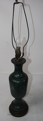 Lot 157 - A large green serpentine table lamp on wooden...