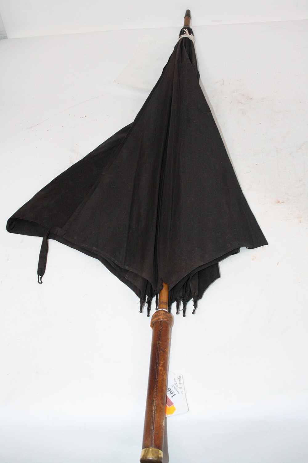 Lot 166 - An early 20th century parasol, having a silk...