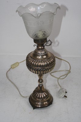Lot 169 - A late Victorian white metal lamp, having...