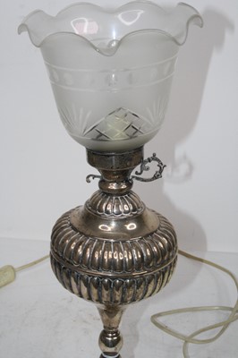 Lot 169 - A late Victorian white metal lamp, having...