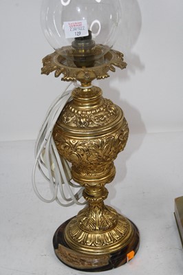 Lot 129 - A Victorian oil lamp having a glass font on an...