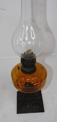 Lot 140 - A late Victorian oil lamp having an opalescent...