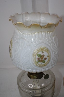 Lot 140 - A late Victorian oil lamp having an opalescent...