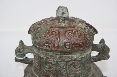Lot 141 - A reproduction Chinese bronzed alloy archaic...