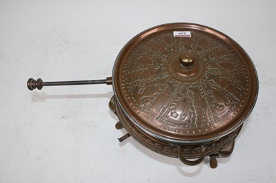Lot 149 - A 20th century eastern copper saucepan on...