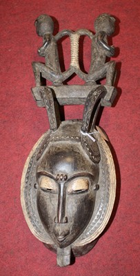 Lot 130 - A West African  carved softwood ritual mask ,...
