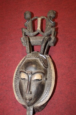 Lot 130 - A West African carved softwood ritual mask ,...