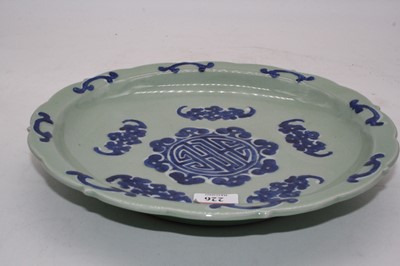 Lot 226 - A Chinese export bowl on a celadon green...